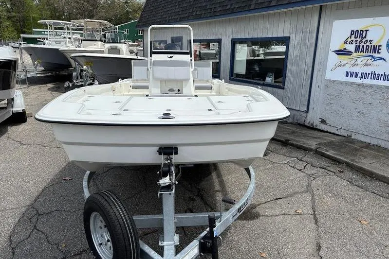Slide: The Image of 2023 Mako SKIFF 19 CC boat on trailer at Port Harbor Marine dealership. - 27