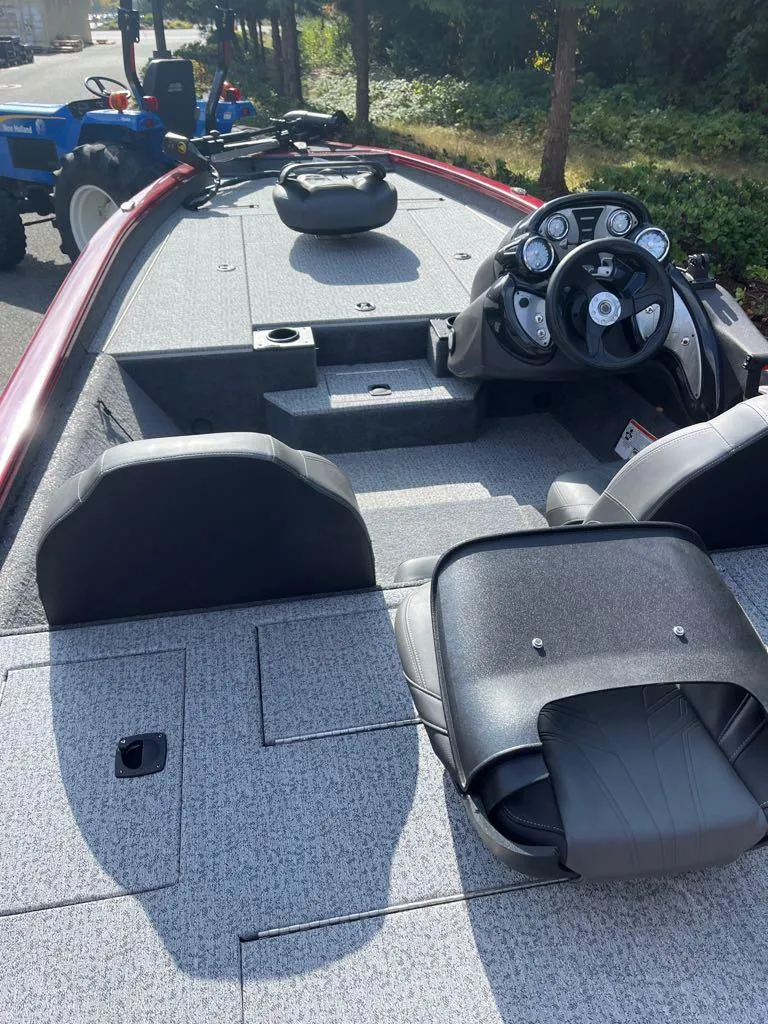 Slide: The Image of 2023 Tracker Pro Team 190 TX fishing boat interior with steering console and seating. - 46