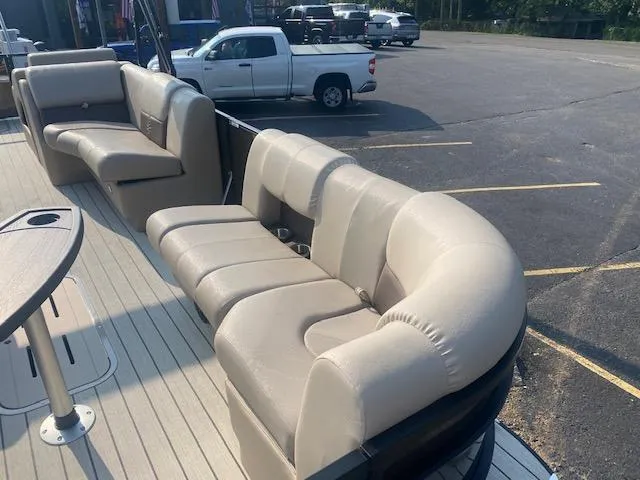 Slide: The Image of Luxurious seating on 2023 SunCatcher Fusion 324SS pontoon boat in parking lot. - 5