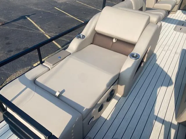 Slide: The Image of 2023 SunCatcher Fusion 324SS boat lounge seating with cup holders on deck. - 8