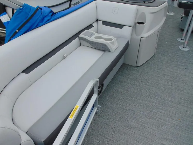 Slide: The Image of 2023 Godfrey Sweetwater 2286 FS boat interior with gray seating and cup holders. - 11