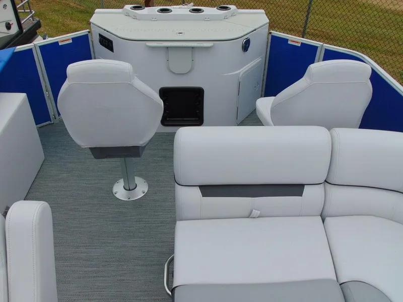 Slide: The Image of 2023 Godfrey Sweetwater 2286 FS boat interior with modern seating and helm station. - 13