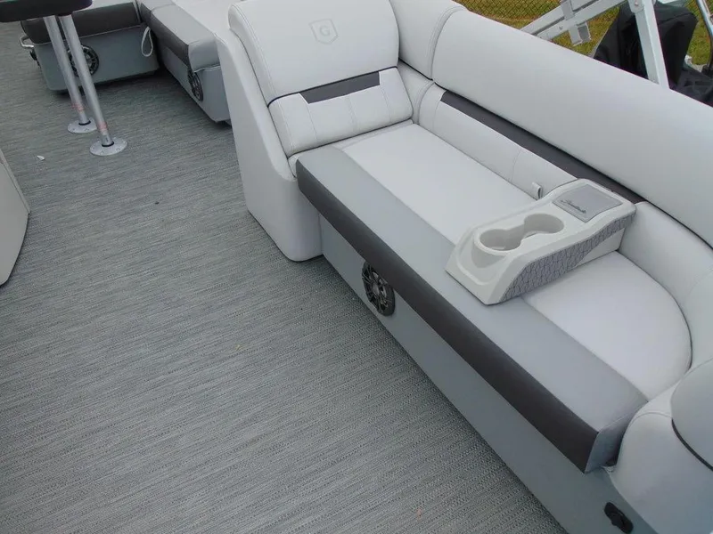 Slide: The Image of 2023 Godfrey Sweetwater 2286 FS boat interior with gray seating and cup holders. - 15
