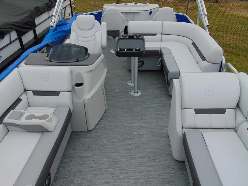 Slide: The Image of 2023 Godfrey Sweetwater 2286 FS boat interior with plush seating and modern amenities. - 16