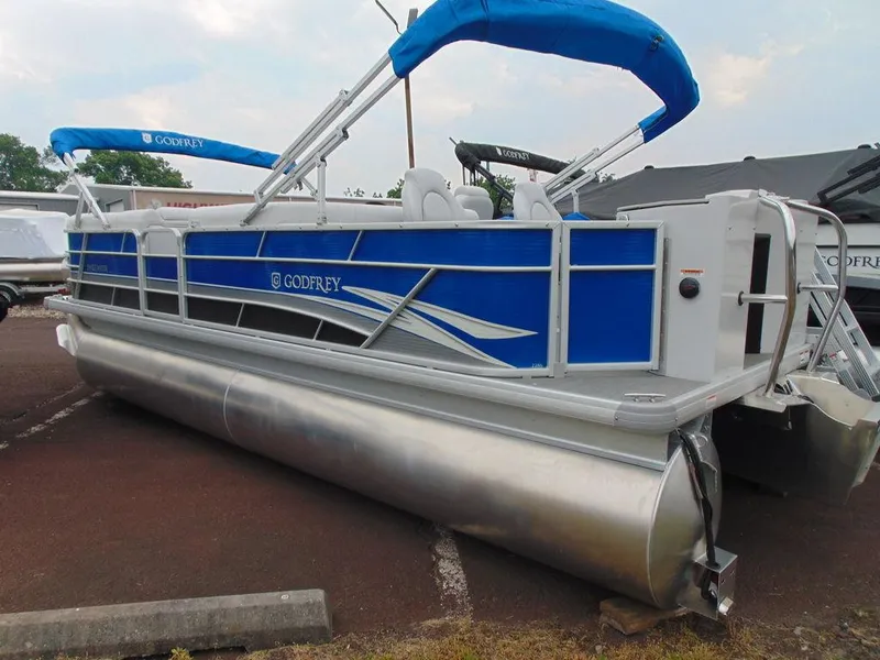 Slide: The Image of 2023 Godfrey Sweetwater 2286 FS pontoon boat with blue canopy and sleek design. - 17