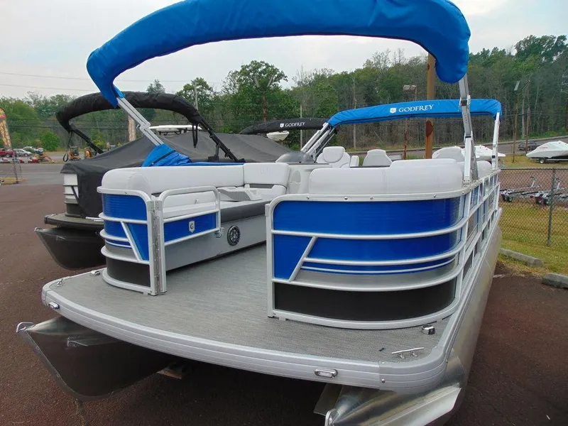 Slide: The Image of 2023 Godfrey Sweetwater 2286 FS pontoon boat with blue canopy and seating. - 19