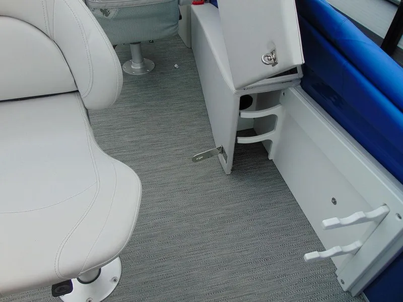 Slide: The Image of Interior of 2023 Godfrey Sweetwater 2286 FS boat, featuring white seating and storage compartments. - 3