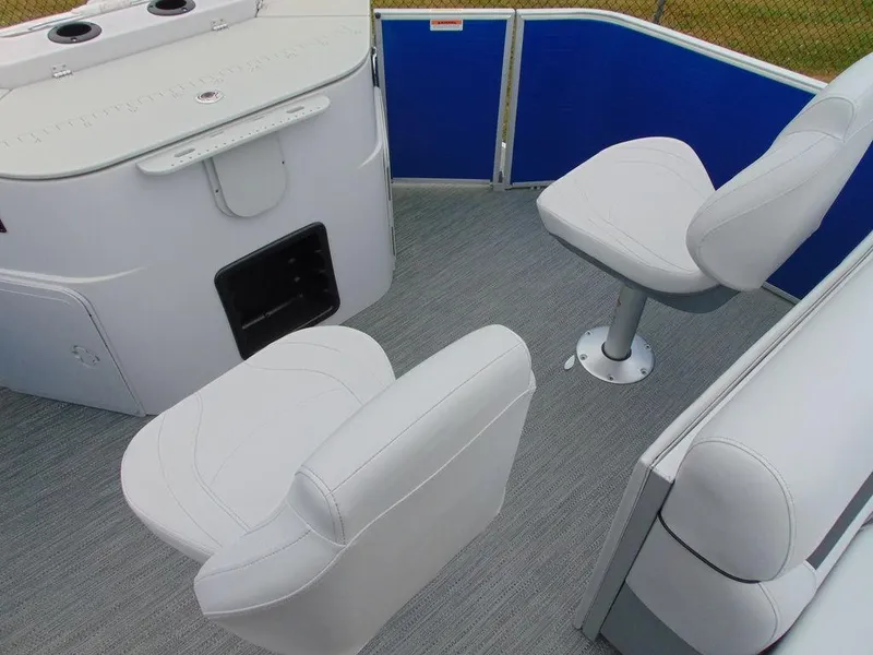 Slide: The Image of 2023 Godfrey Sweetwater 2286 FS boat interior with white seating and blue paneling. - 6