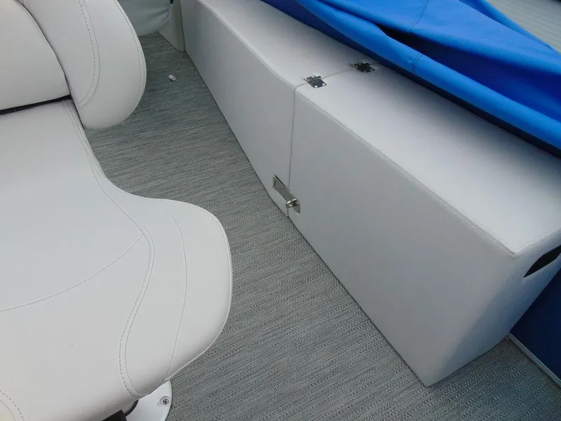 Slide: The Image of 2023 Godfrey Sweetwater 2286 FS interior with white seating and storage compartment. - 8