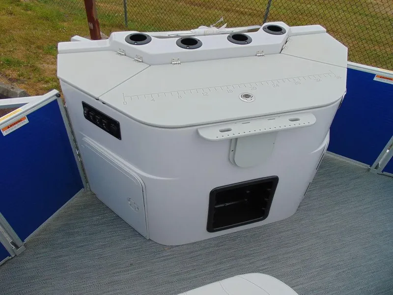 Slide: The Image of 2023 Godfrey Sweetwater 2286 FS boat console with cup holders and storage compartments. - 9