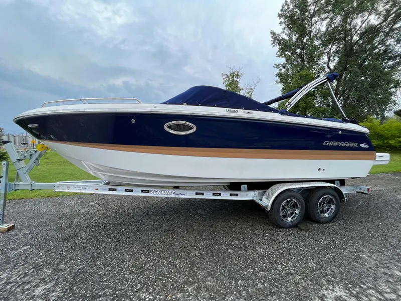 The Image of 2023 Chaparral 250 OSX boat on a trailer, side view. - 0