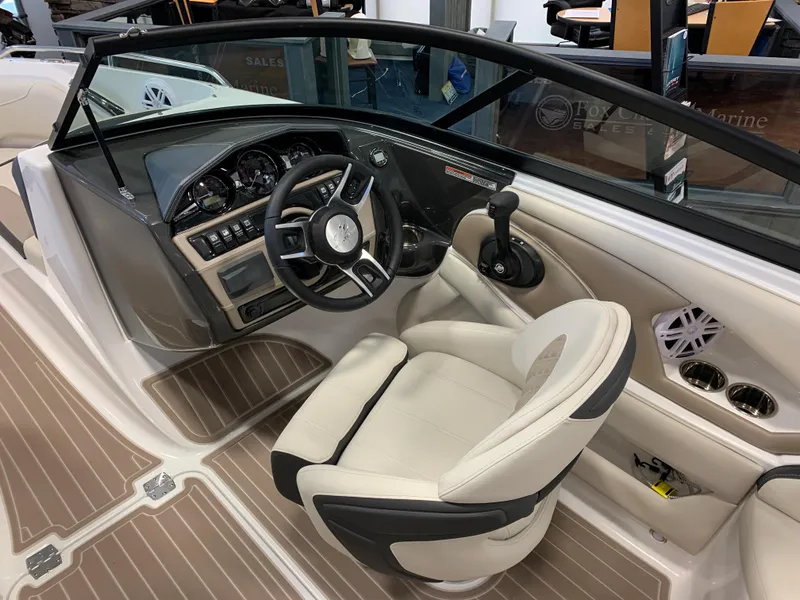 Slide: The Image of 2024 Monterey 224FS boat interior with steering wheel and control panel. - 5