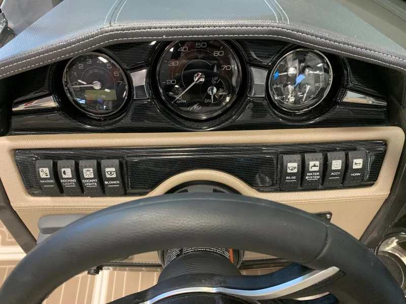Slide: The Image of Dashboard of 2024 Monterey 224FS boat with gauges and control switches. - 6