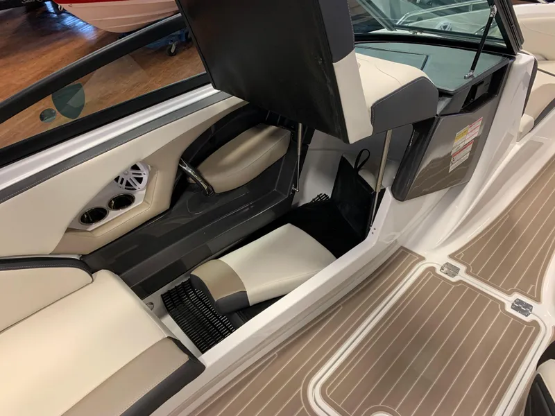Slide: The Image of 2024 Monterey 224FS boat interior with beige seating and sleek design. - 8