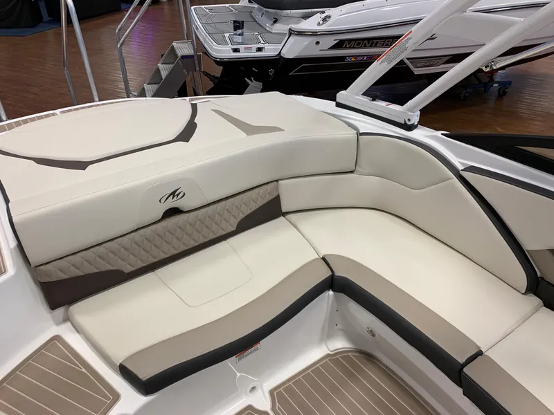 Slide: The Image of 2024 Monterey 224FS boat interior with beige seating and stylish design. - 9