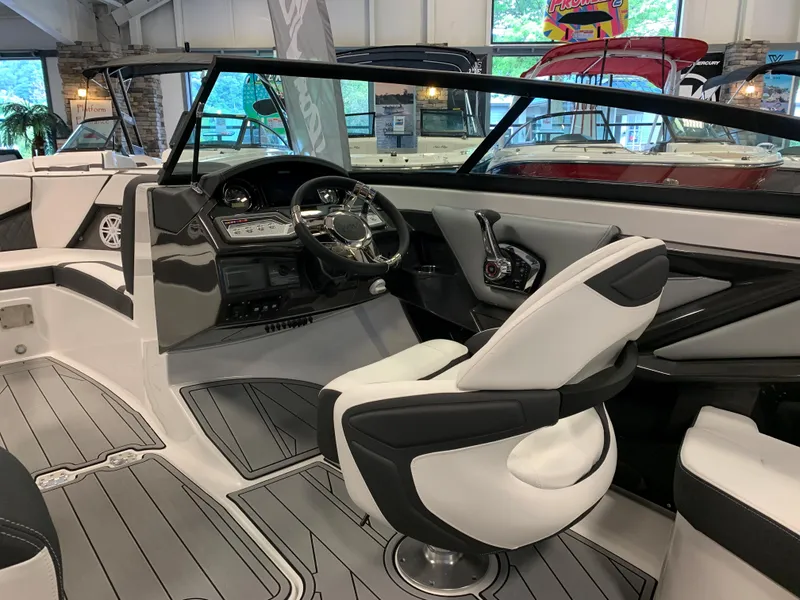 Slide: The Image of 2024 Monterey 238 Super Sport boat interior with sleek design and modern dashboard. - 10