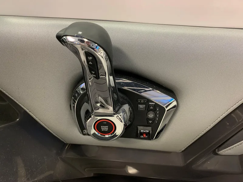 Slide: The Image of 2024 Monterey 238 Super Sport throttle control with start/stop button and sleek design. - 12