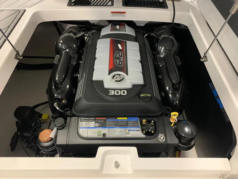 Slide: The Image of 2024 Monterey 238 Super Sport engine compartment with powerful 6.2L Mercury 300 engine. - 14