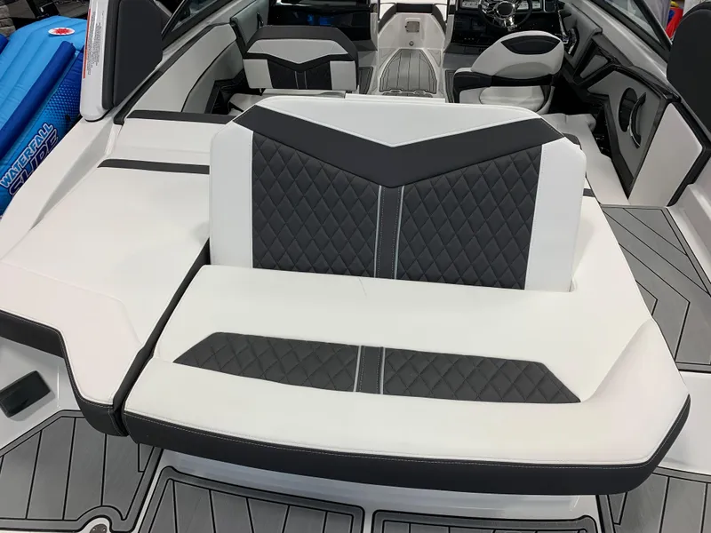 Slide: The Image of 2024 Monterey 238 Super Sport boat interior with stylish black and white seating. - 5