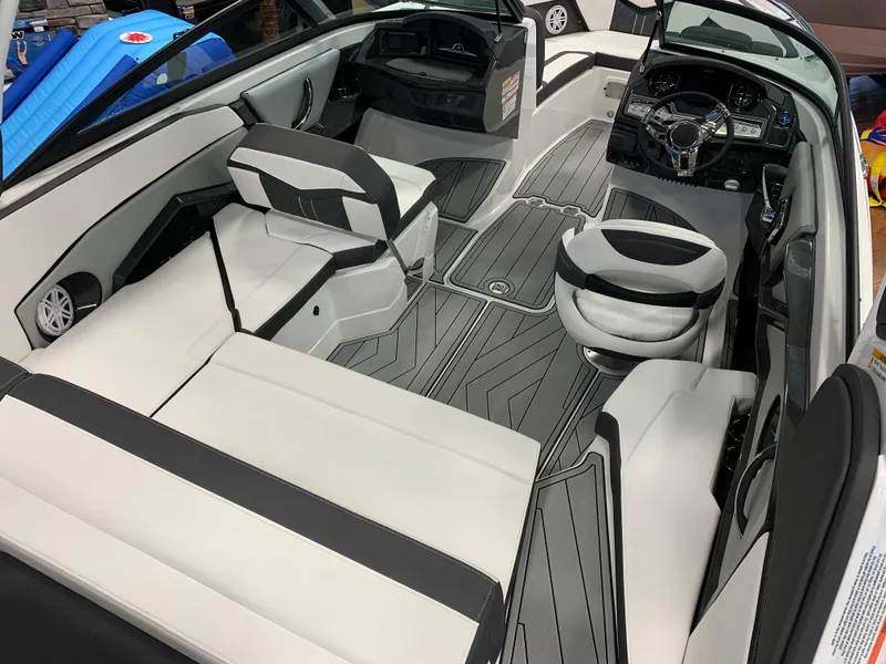 Slide: The Image of 2024 Monterey 238 Super Sport boat interior with sleek seating and modern dashboard design. - 7