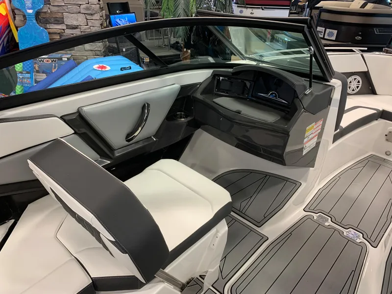 Slide: The Image of 2024 Monterey 238 Super Sport boat interior with sleek seating and modern dashboard design. - 8