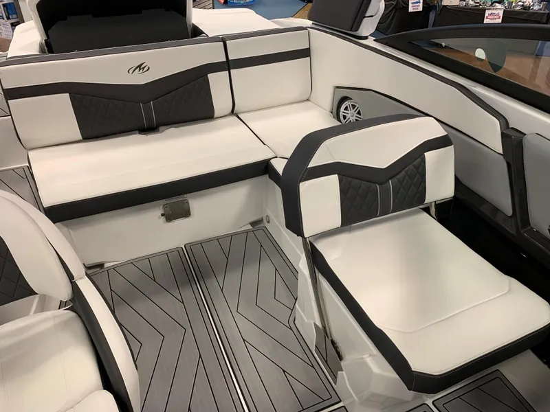 Slide: The Image of 2024 Monterey 238 Super Sport boat interior with sleek white and black seating design. - 9
