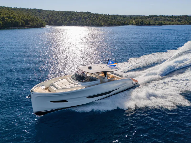 Slide: The Image of 2025 Solaris Power 60 Open yacht cruising on blue ocean waters. - 25