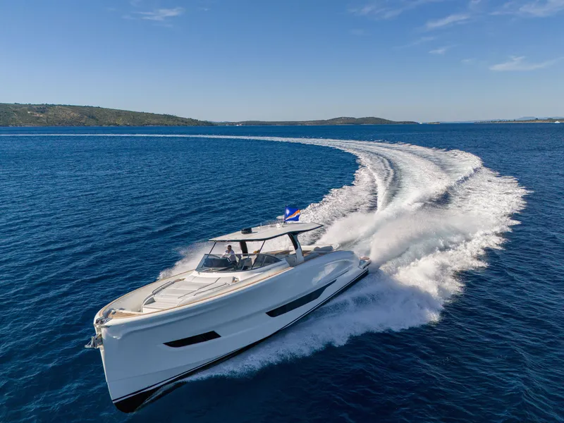 Slide: The Image of 2025 Solaris Power 60 Open yacht cruising on open blue waters. - 26
