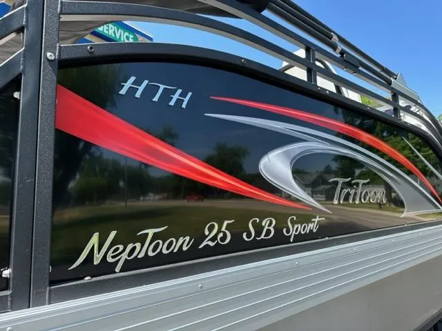 Slide: The Image of 2023 JC Neptoon 25 SB Sport boat with sleek graphics and design. - 4