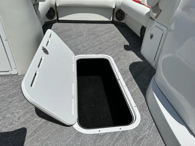 Slide: The Image of Open storage compartment on 2023 JC Neptoon 25 SB Sport boat deck. - 15