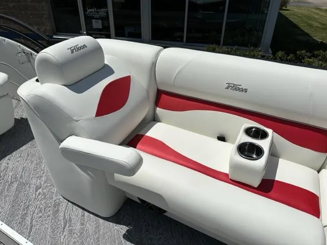 Slide: The Image of 2023 JC Neptoon 25 SB Sport boat seating with red and white upholstery and cup holders. - 21