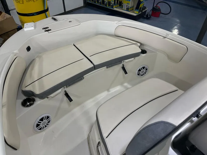 Slide: The Image of 2023 Stingray 173CC boat interior with cushioned seating and built-in speakers. - 14