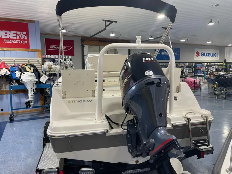 Slide: The Image of 2023 Stingray 173CC boat with Yamaha 90 engine displayed in showroom. - 7