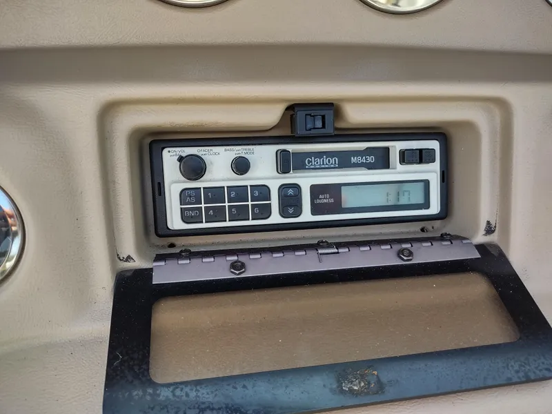 Slide: The Image of Clarion marine radio in 1997 Sea Ray 240 SIGNATURE boat dashboard. - 11