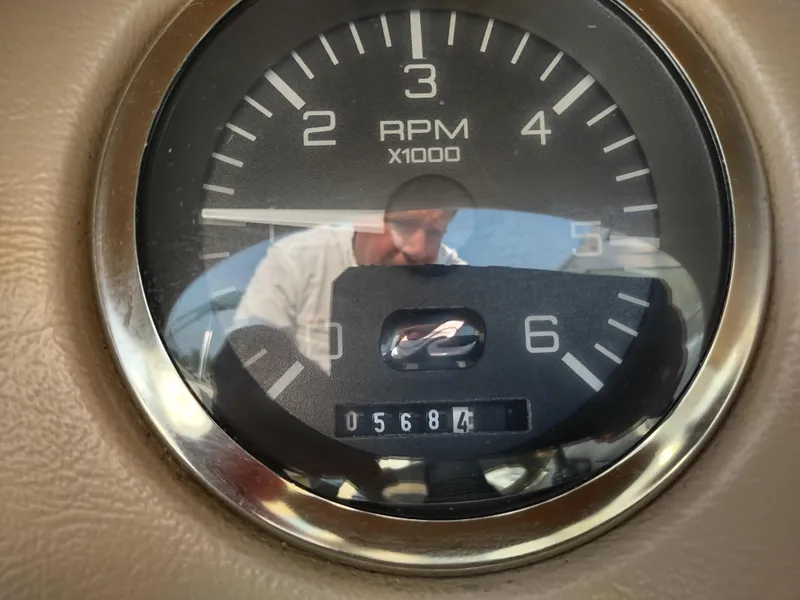 Slide: The Image of Close-up of 1997 Sea Ray 240 SIGNATURE RPM gauge showing 5684 hours. - 12