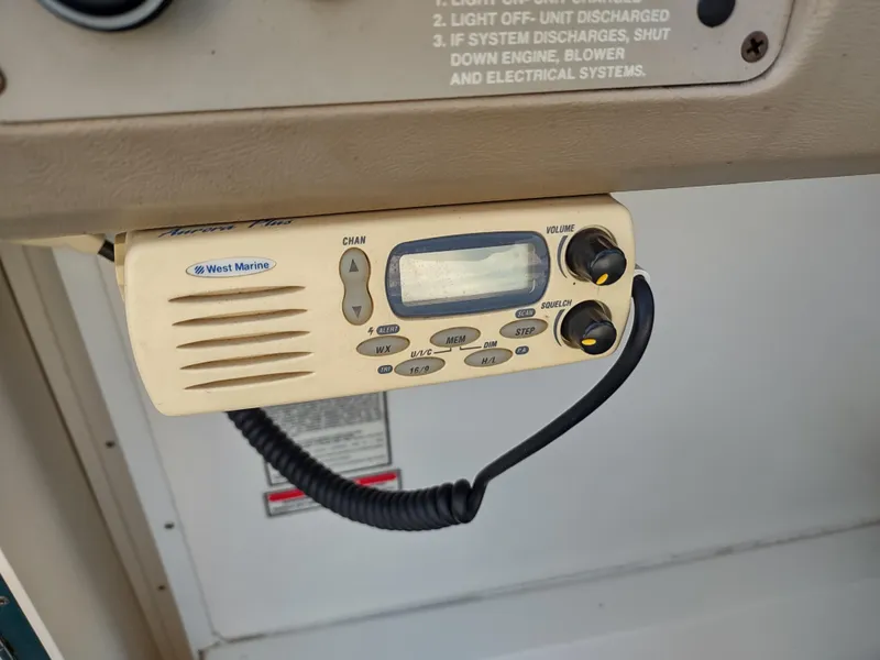 Slide: The Image of Radio system on a 1997 Sea Ray 240 SIGNATURE boat dashboard. - 14