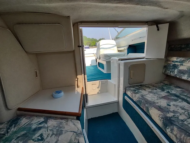 Slide: The Image of Interior of 1997 Sea Ray 240 SIGNATURE boat with seating and cabin view. - 22