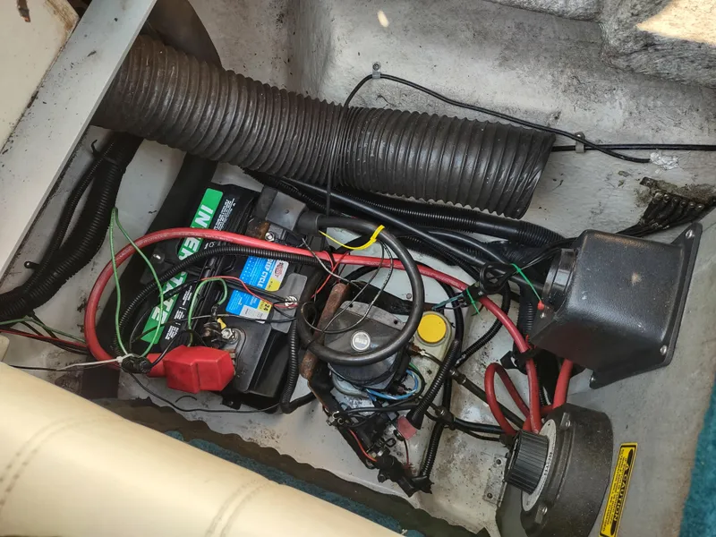 Slide: The Image of Electrical components and wiring inside a 1997 Sea Ray 240 SIGNATURE boat. - 24