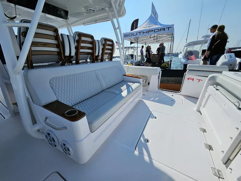 Slide: The Image of 2025 Southport 38 FE boat interior with seating, showcased at a marine event. - 4