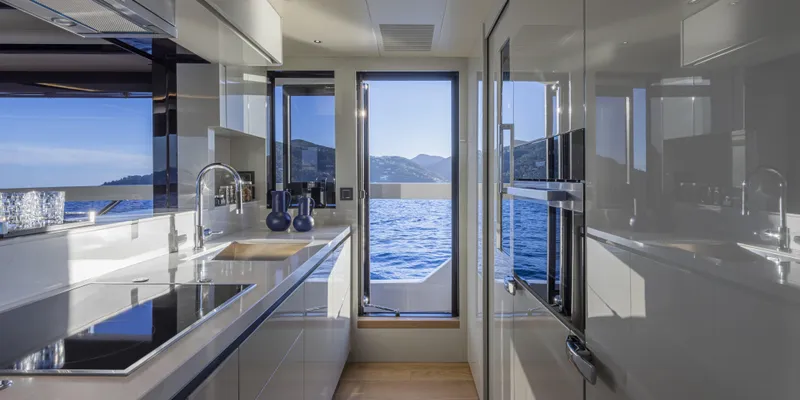 Slide: The Image of Luxurious kitchen interior of 2025 Absolute NAVETTA 75 yacht with ocean view. - 24