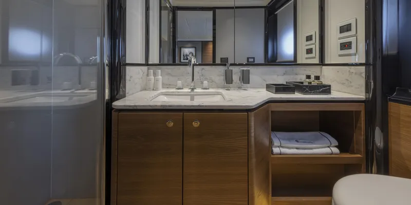 Slide: The Image of Luxurious bathroom in 2025 Absolute NAVETTA 75 yacht with modern fixtures and elegant design. - 33
