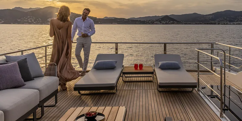 Slide: The Image of Couple enjoying sunset on Absolute NAVETTA 75 yacht deck, 2025 model. - 9