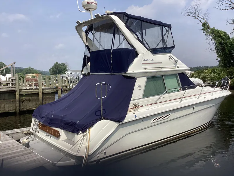 The Image of 1994 Sea Ray 370 Sedan Bridge docked at a marina. - 0