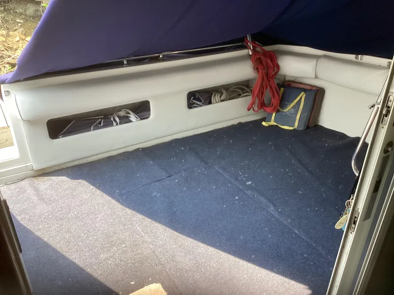 Slide: The Image of Interior view of 1994 Sea Ray 370 Sedan Bridge boat with storage compartments. - 22