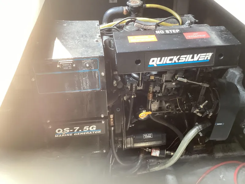 Slide: The Image of 1994 Sea Ray 370 Sedan Bridge Quicksilver marine generator. - 32