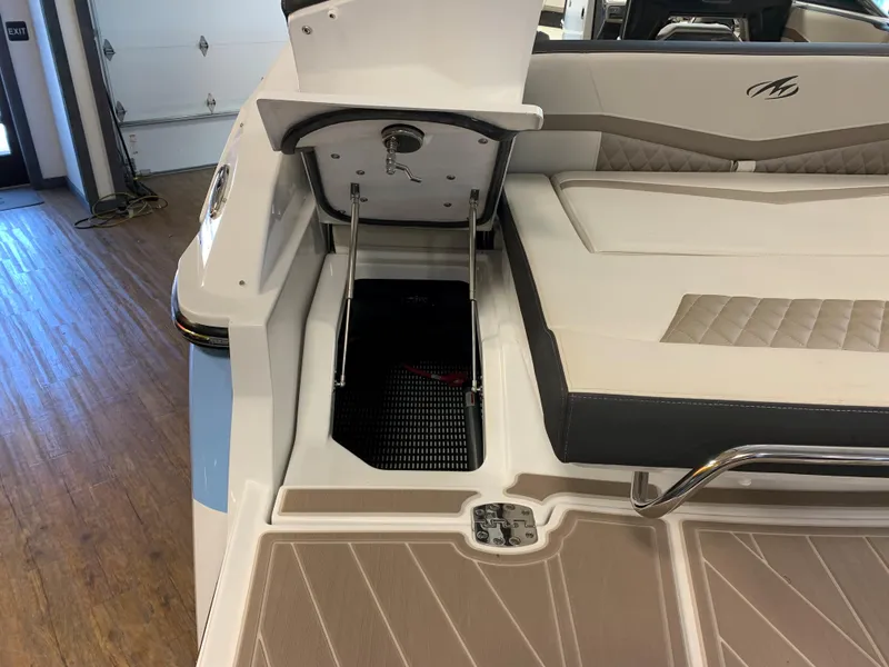 Slide: The Image of 2024 Monterey 278 Super Sport boat interior with open storage compartment. - 12