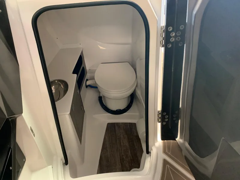 Slide: The Image of 2024 Monterey 278 Super Sport boat interior bathroom with toilet and sink. - 6