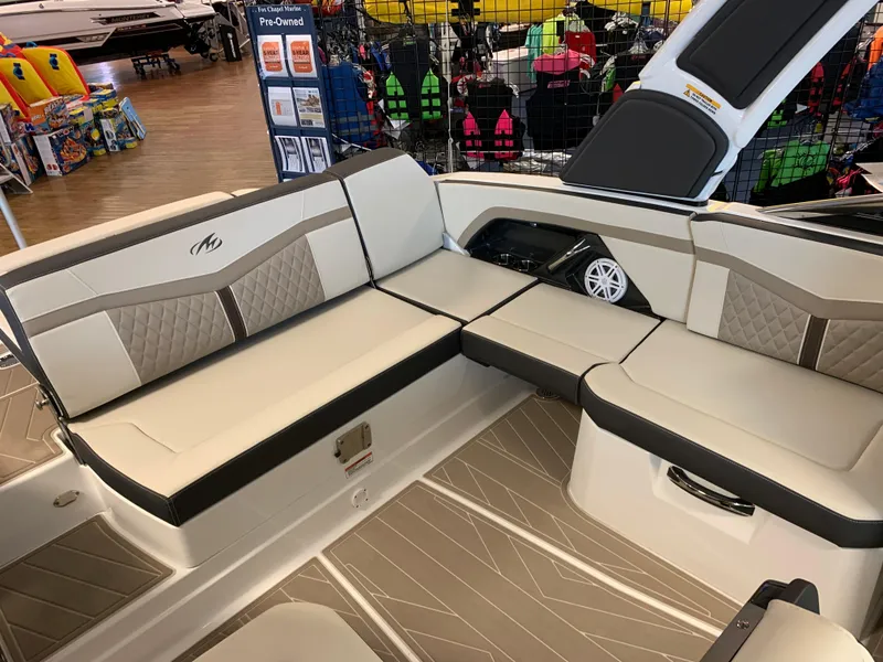Slide: The Image of 2024 Monterey 278 Super Sport boat interior with beige seating and modern design. - 8