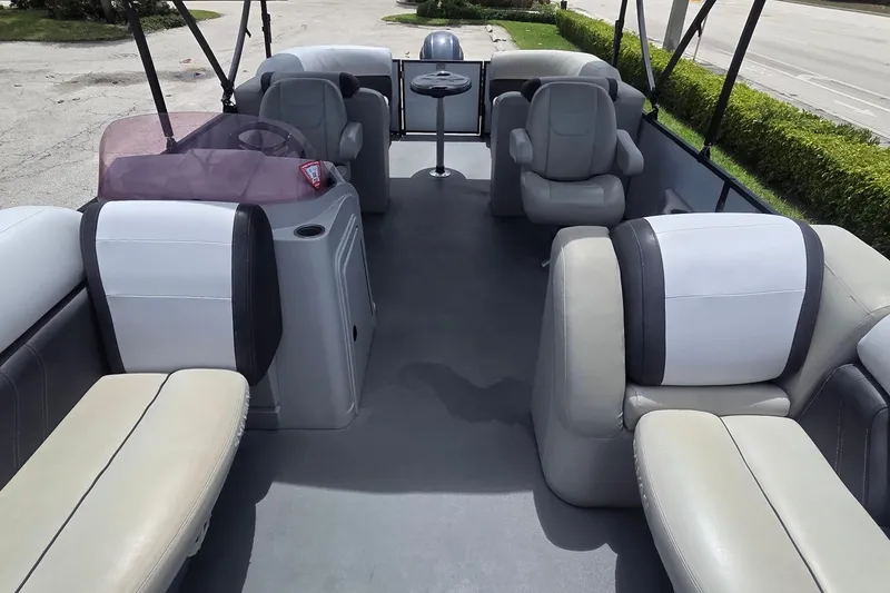 Slide: The Image of Interior of 2022 Sylvan Mirage X X3 pontoon boat with seating and table. - 13