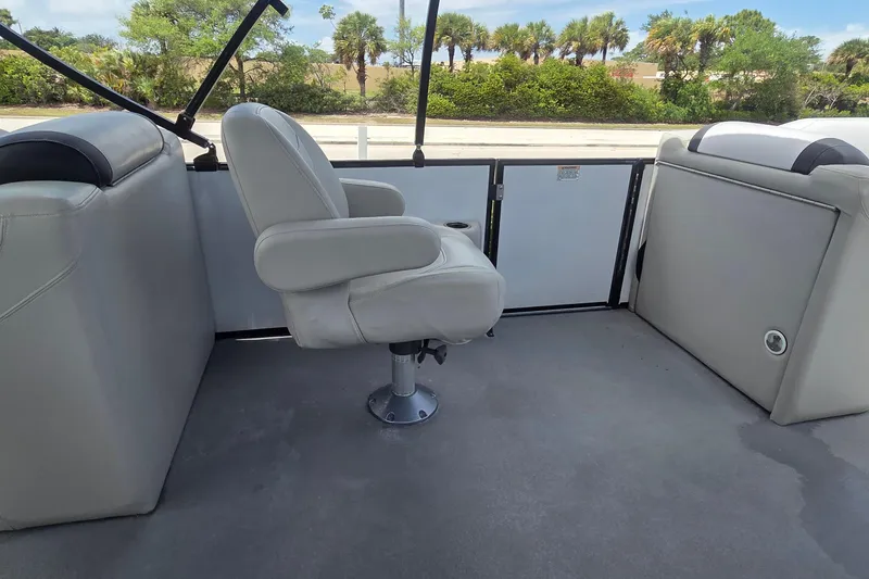 Slide: The Image of Captain's chair on 2022 Sylvan Mirage X X3 pontoon boat deck. - 14